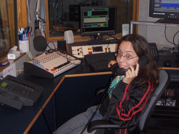 Darcy screening calls at the Free FM studio console